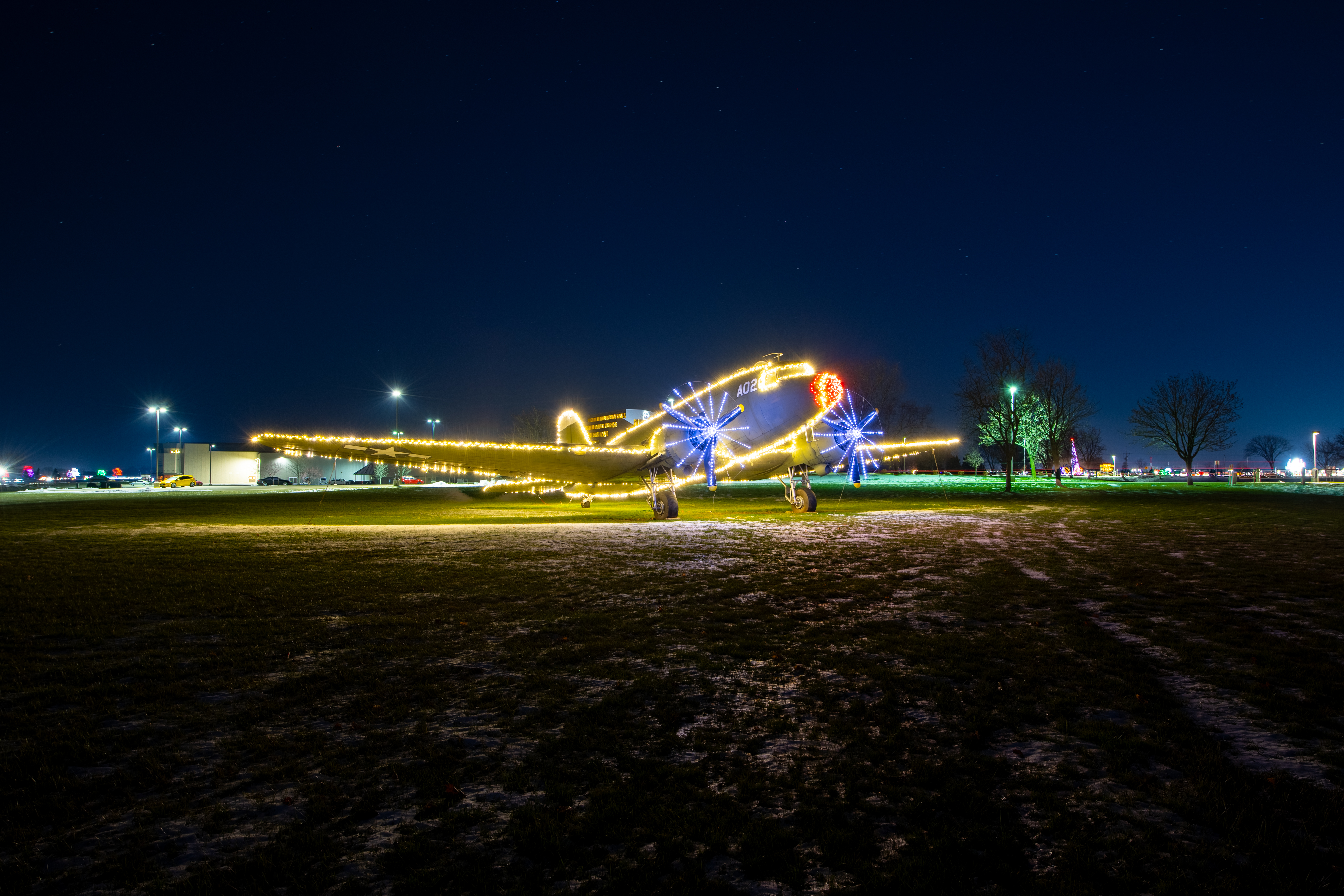 airplane outlined in christmas lights